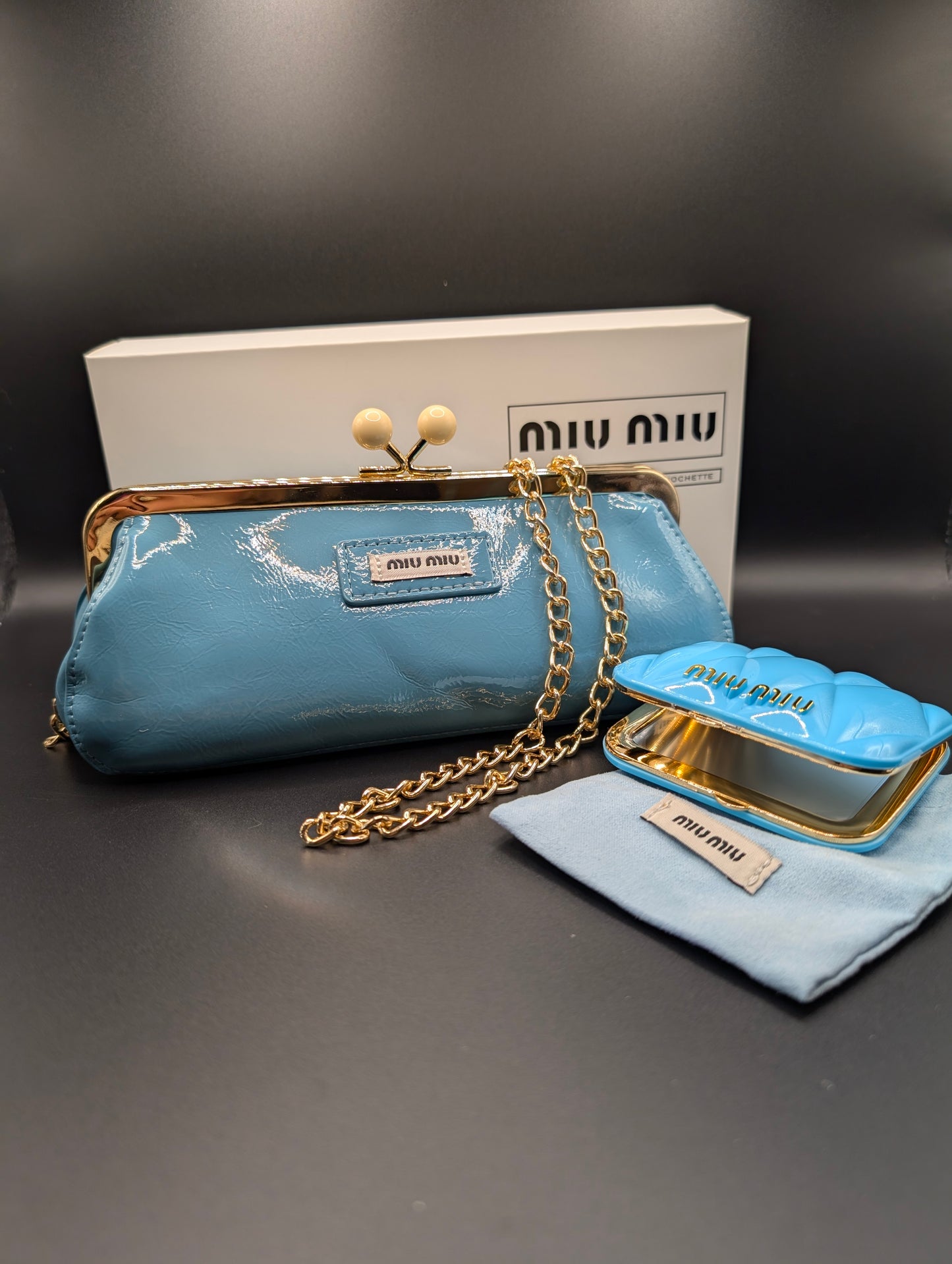 Miu Miu Blue Clutch Bag with Gold Chain And Compact Mirror
